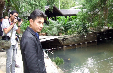 Banglamung District Constable Phongsith Pijnant investigates buildings blocking the South Pattaya canal.